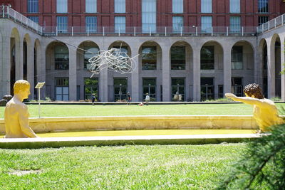 Statue against building