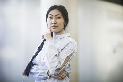 Young asia woman with paper in an office standing