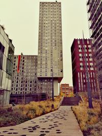 Modern buildings in city against clear sky