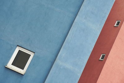 Low angle view of window on wall of building