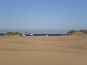 Scenic view of beach against clear sky