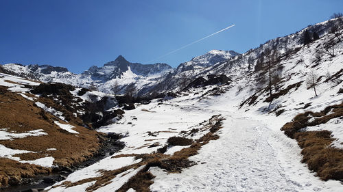 Scenic view of snowcapped mountains against sky