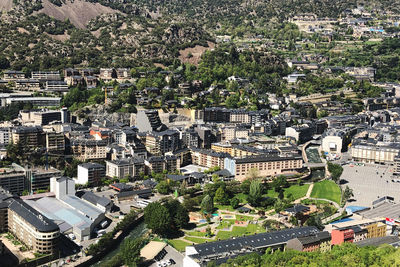 High angle view of trees and buildings in city