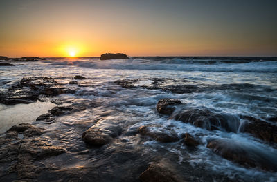 Scenic view of sea against sky during sunset