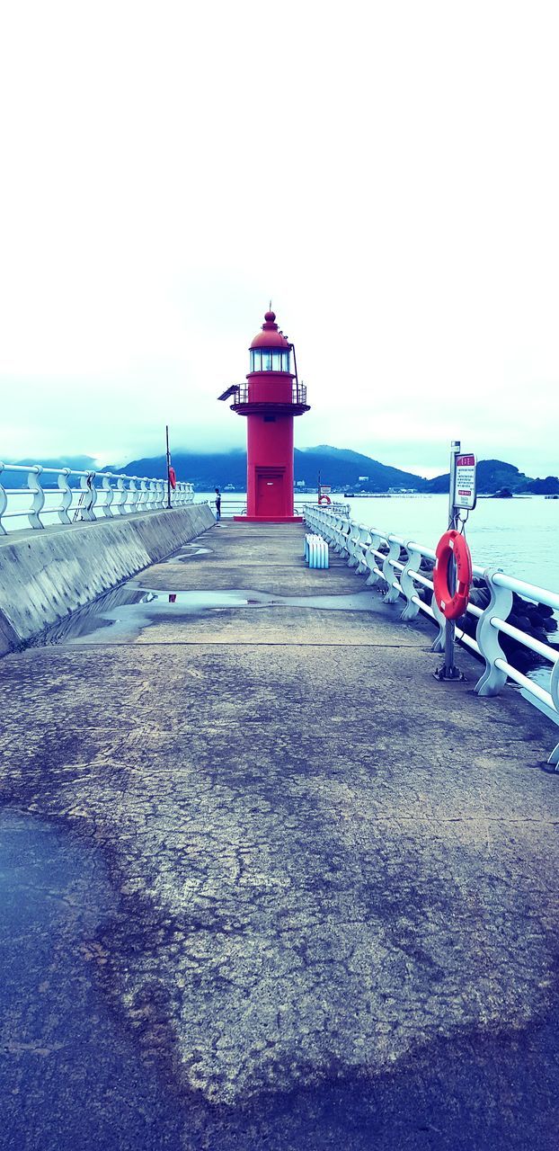 water, lighthouse, sea, guidance, sky, security, built structure, architecture, safety, building exterior, protection, tower, direction, building, nature, no people, horizon over water, transportation, day, outdoors