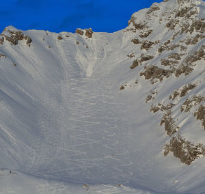 Traces of skiers on dangerous slope