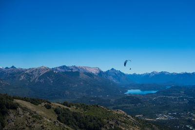 Scenic view of mountains against clear blue sky