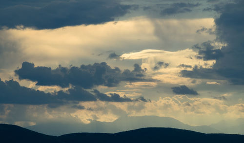 Low angle view of dramatic sky during sunset