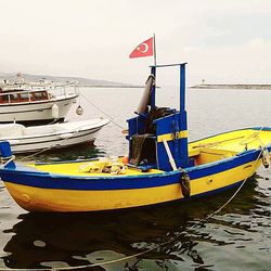 Boats moored in sea