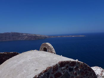 Scenic view of sea against clear blue sky