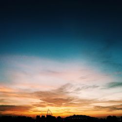 Silhouette of trees against sky at sunset