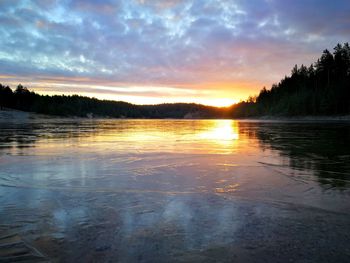 Scenic view of lake against sky during sunset