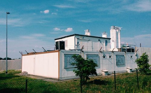 Low angle view of factory against sky