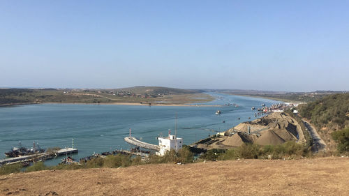 Scenic view of beach by sea against sky