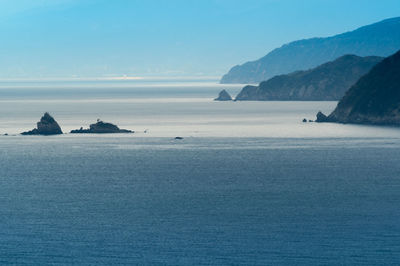 Telephoto shot of the komomi coastline featuring small, weathered sea stacks and headlands.