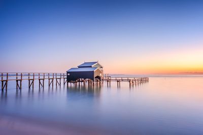 Scenic view of sea against clear sky during sunset