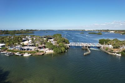 Waterside aerial view of bridge and tiki bar in venice, florida