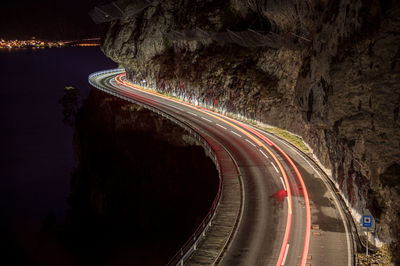 High angle view of light trails on road at night