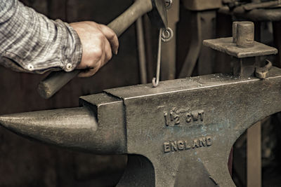 Close-up of man working at workshop