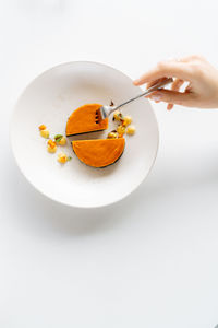 Close-up of food in plate on white background