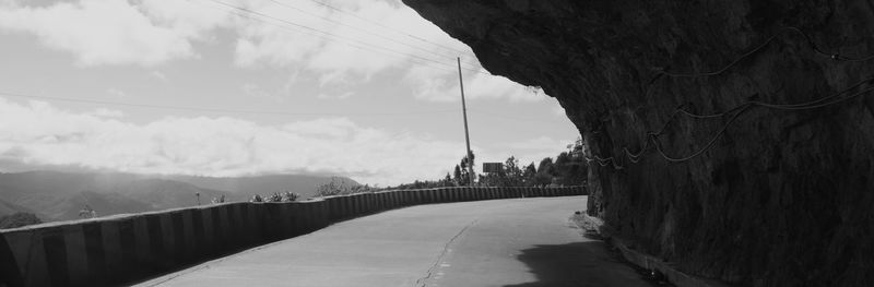 Panoramic view of road amidst city against sky