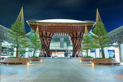 Illuminated modern building against sky at night