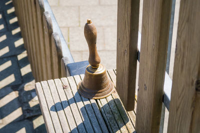 High angle view of bell on wood