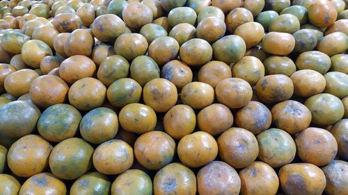 Full frame shot of lemons for sale at market stall