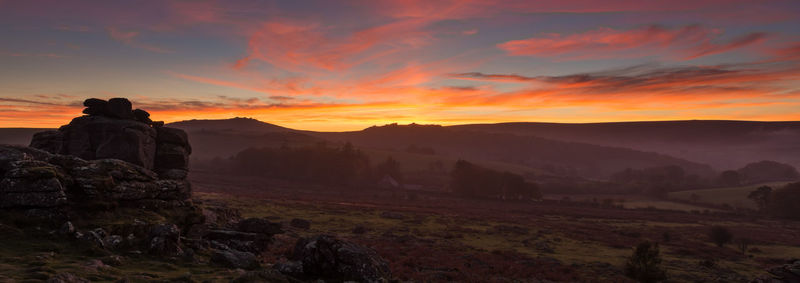 Scenic view of landscape against sky during sunset