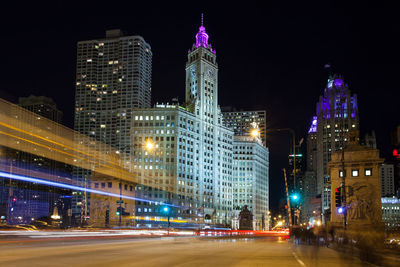 Illuminated city buildings at night