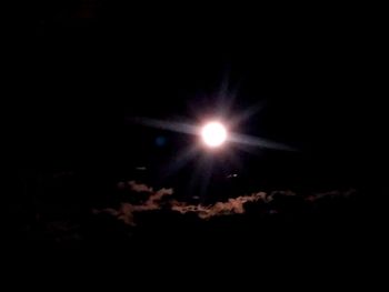 Close-up of illuminated moon against black background