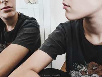Portrait of young man sitting at home