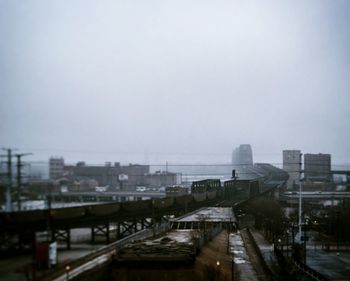 High angle view of buildings in city against sky
