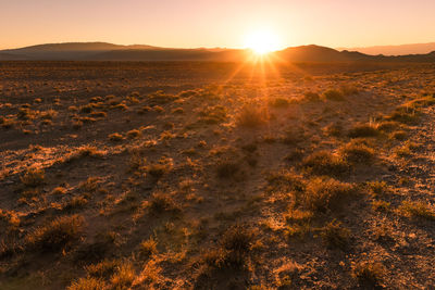 Scenic view of landscape against sky during sunset