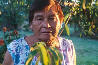 Close-up portrait of senior woman on field