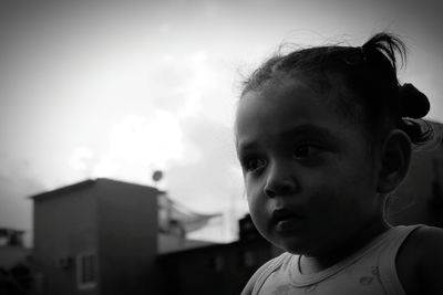 Portrait of boy against sky