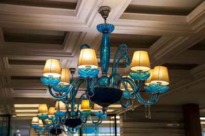 Close-up of turquoise chandeliers in hotel lobby