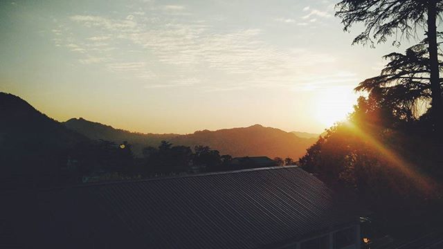 sunset, sun, sky, silhouette, mountain, sunbeam, sunlight, scenics, tranquil scene, tranquility, beauty in nature, lens flare, landscape, nature, mountain range, cloud - sky, tree, idyllic, cloud, outdoors