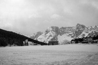 Snow covered landscape against sky