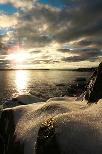 Scenic view of sea against dramatic sky