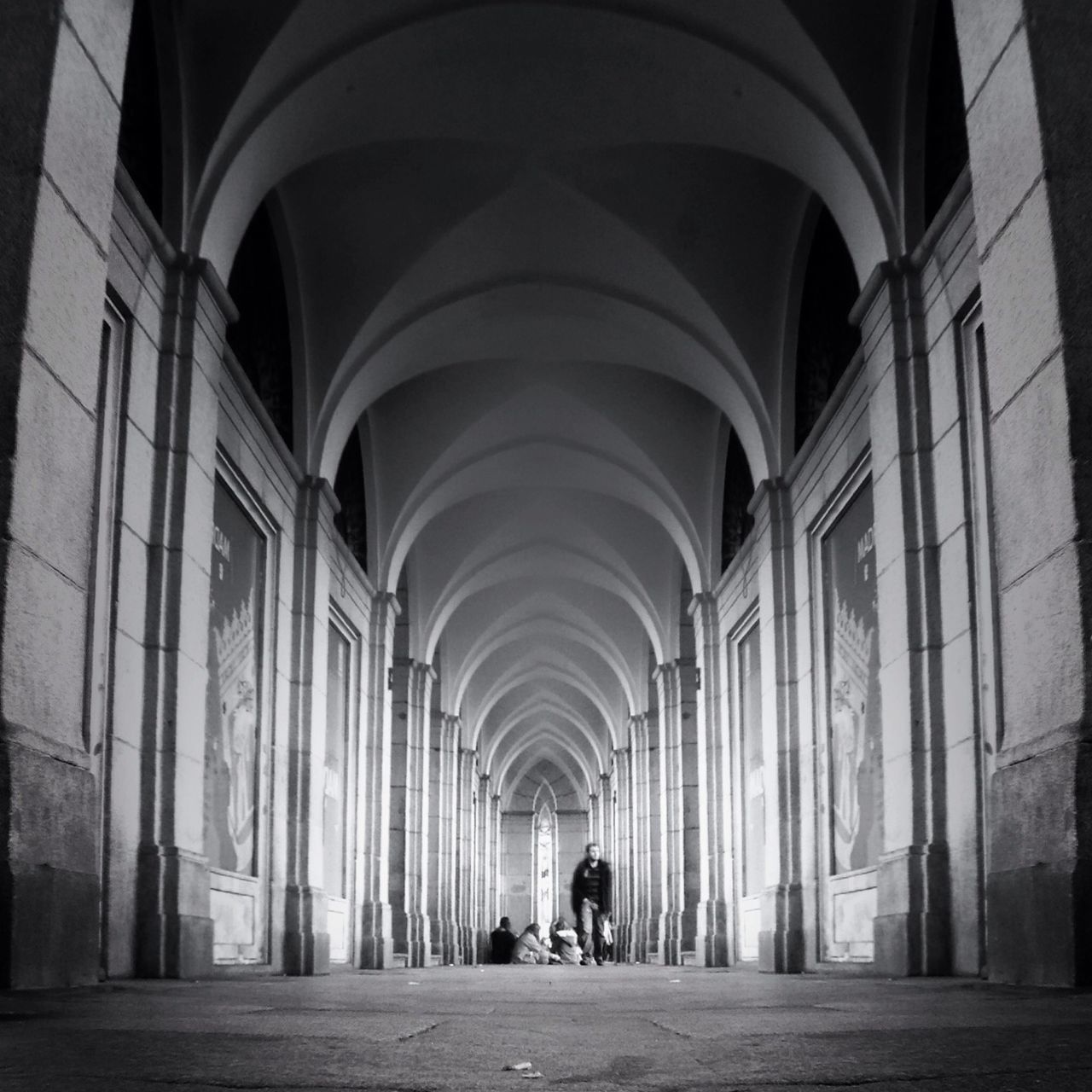 arch, architecture, indoors, built structure, architectural column, men, corridor, ceiling, person, archway, walking, column, arched, the way forward, lifestyles, full length, history, entrance, travel destinations