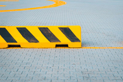 High angle view of yellow text on street