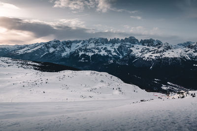 Scenic view of snow covered mountains against sky