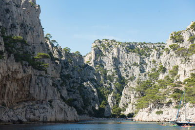 Scenic view of sea and mountains against sky