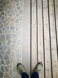 Low section of man standing on floor