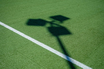 Shadow of person on field