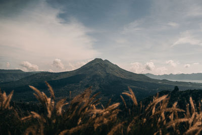 Scenic view of volcanic mountain against sky