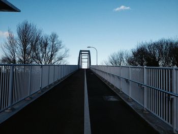 Footbridge against clear sky