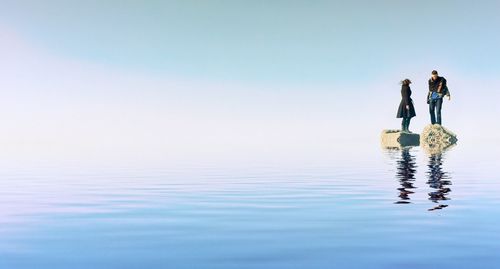 Reflection of people in water