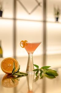 Close-up of drink with orange slice on table